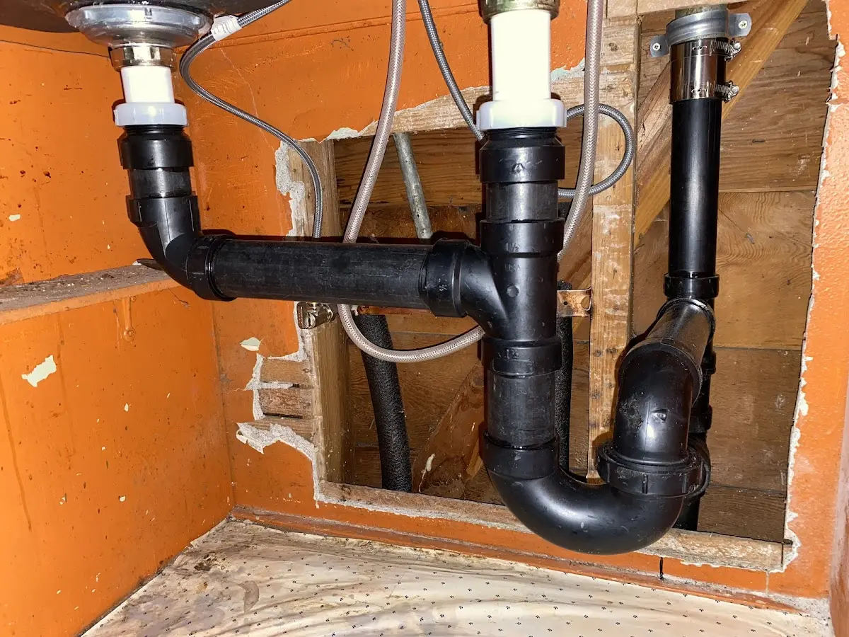 Professional Garbage Disposal Repair equipment and tools on the job in St. Anthony